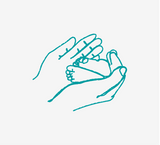 Baby's feet being held inside hands