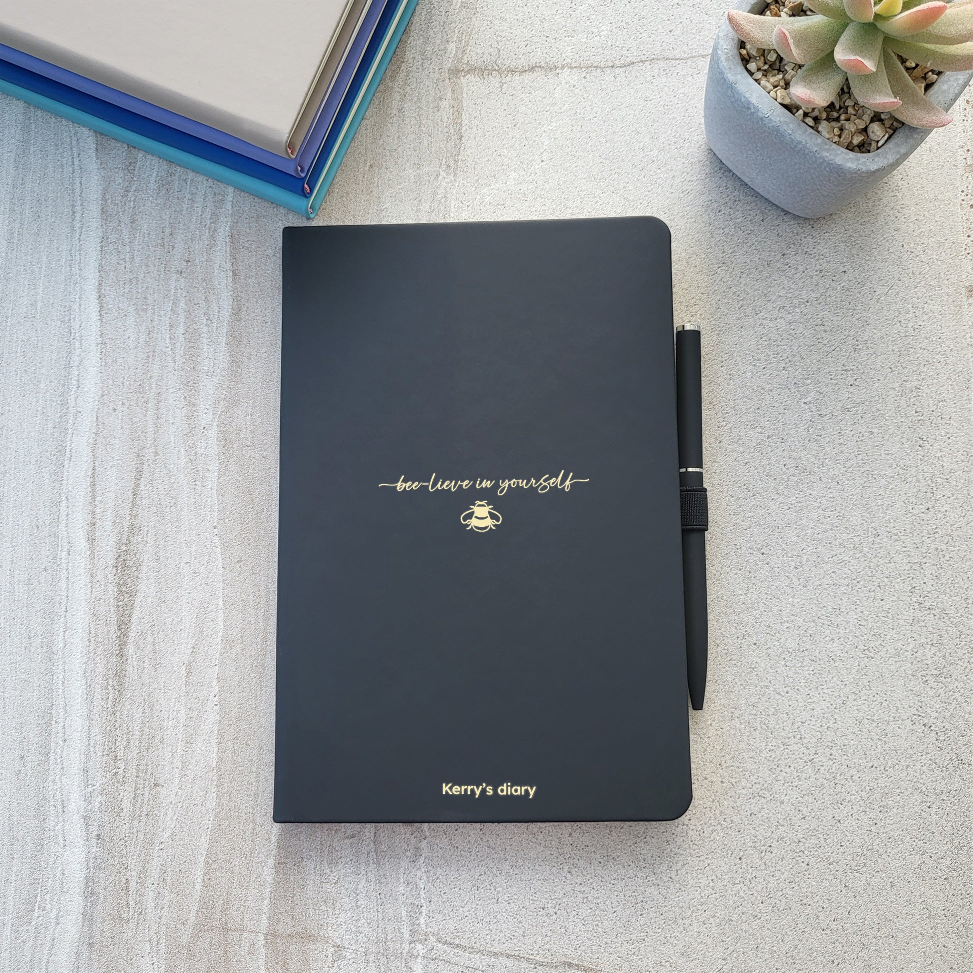 Black personalised bee design notebook with matching pen