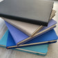 Different colour notebooks together