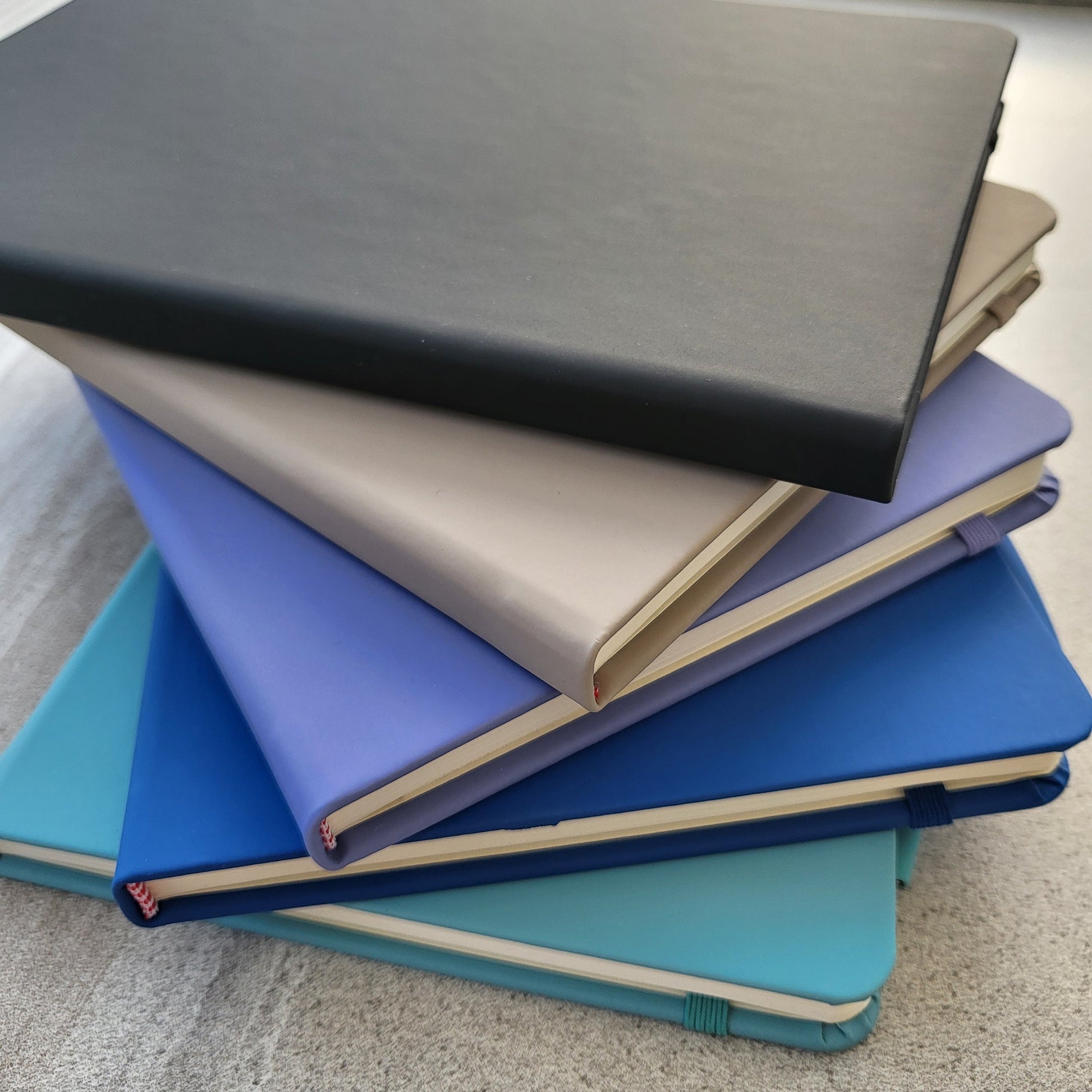 Different colour notebooks together