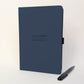 Navy personalised A5 work journal with Hannah Collins and Creative Director on the cover in black foil, with matching black pen. Personalised notebook gift for a colleague, employee or new job.