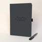 Personalised black journal and black pen with handwritten-style text reading “The one where Em and Joe moved to Australia”, a thoughtful emigrating or moving abroad gift.