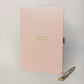 Blush personalised employee thank you journal for Emma reading “Bringer of Calm”, shown with a gold pen.