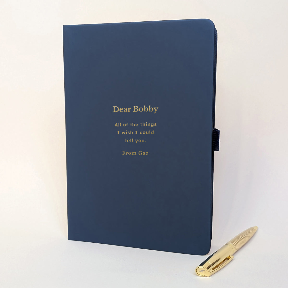 Personalised navy remembrance journal with gold pen, featuring Dear Bobby and All of the things I wish I could tell you in gold foil.