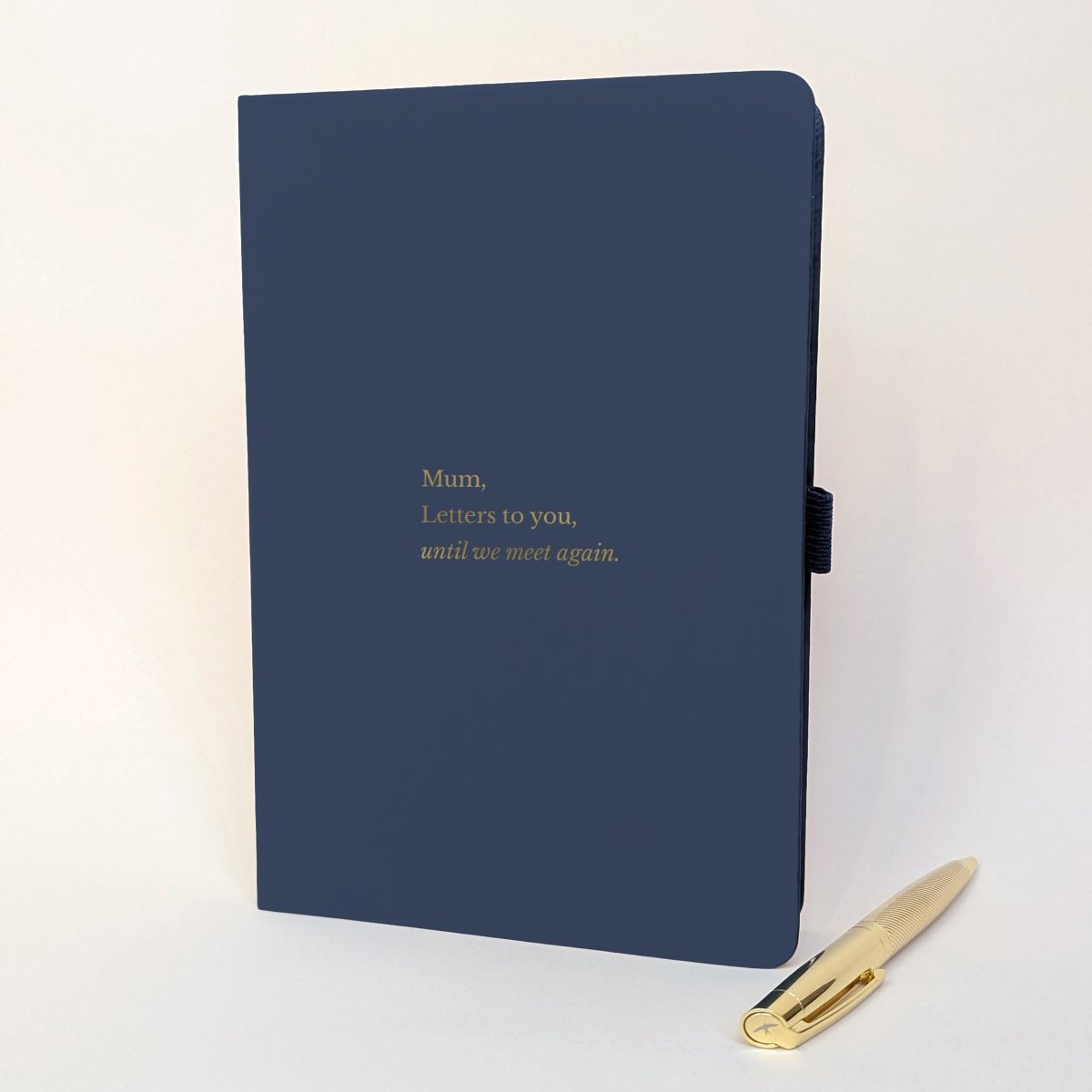 Personalised navy grief journal reading “Mum, Letters to you, until we meet again” with gold pen.