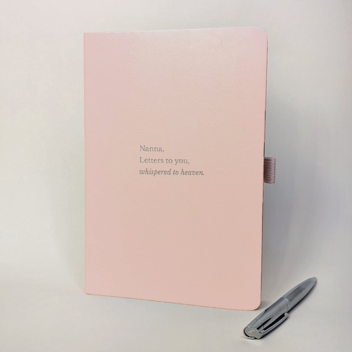 Personalised blush grief journal reading “Nanna, Letters to you, whispered to heaven” with silver pen.