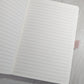 Open A5 keepsake journal showing the thick 100gsm lined writing pages