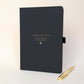 Personalised black memorial journal for Dad with gold “Letters to Dad”, “Gone from this world, never from my heart” wording, heart detail and matching gold metal pen.