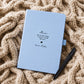 Blue lifestyle journal
Personalised pale blue Mum memorial journal with black pen resting on a warm chunky knit blanket, featuring All of the things I wish I could tell you.