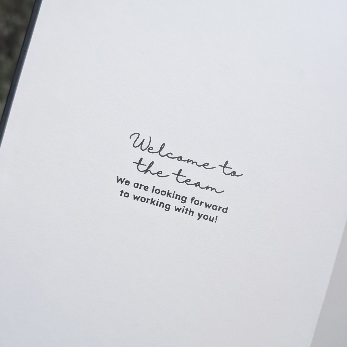 Example personalised inside-cover message reading Welcome to the team and We are looking forward to working with you, available with this personalised new job or colleague journal.