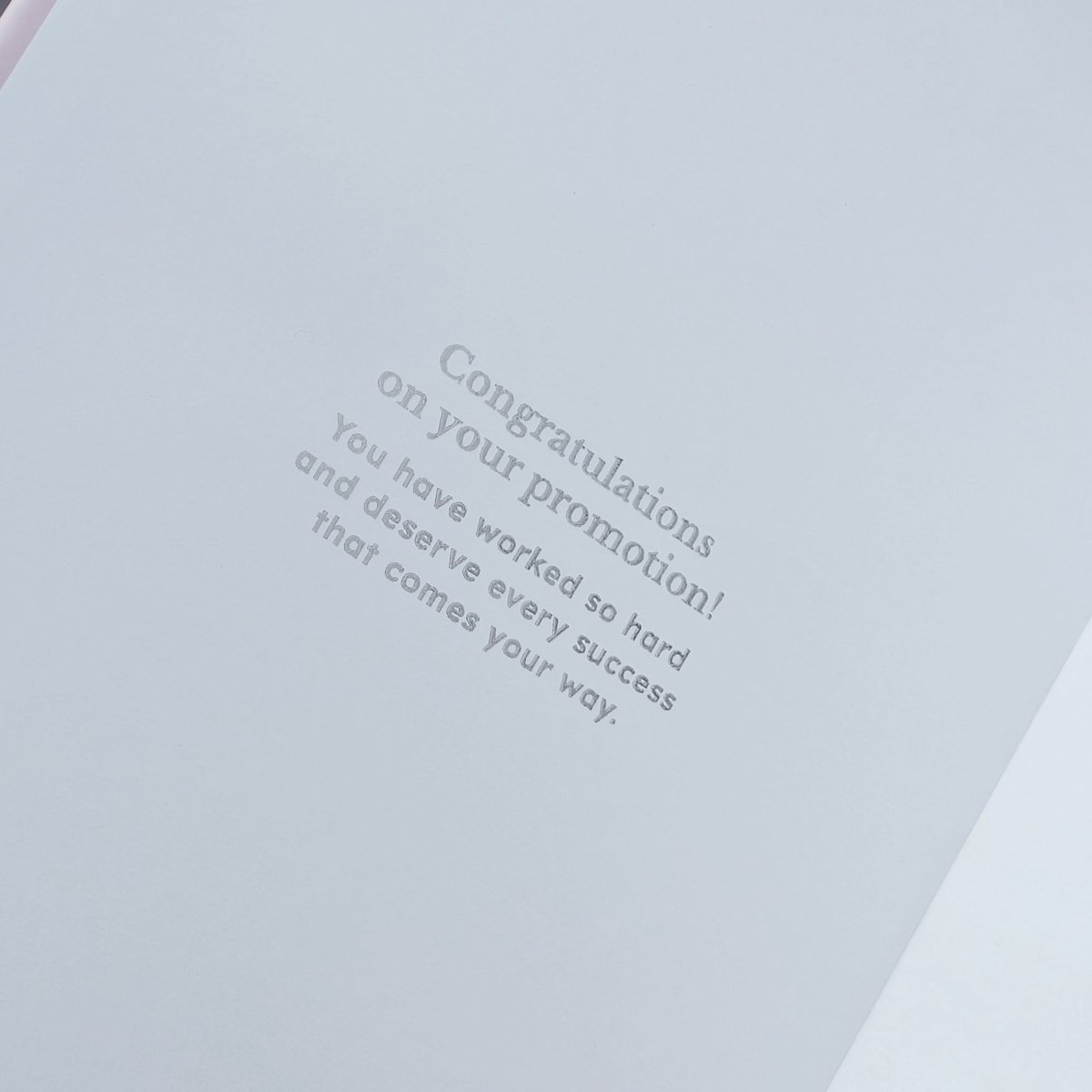 Example personalised inside-cover message congratulating someone on their promotion, printed inside an A5 personalised work journal for a thoughtful promotion or career gift.