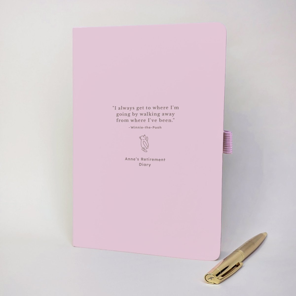 Personalised pink retirement journal featuring the quote “I always get to where I’m going by walking away from where I’ve been”, custom name and gold metal pen.