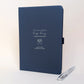 Navy personalised wedding planning journal with silver flower invitation design, “One beautiful big day, a thousand tiny details”, names Jess and Lee, and matching silver metal pen.